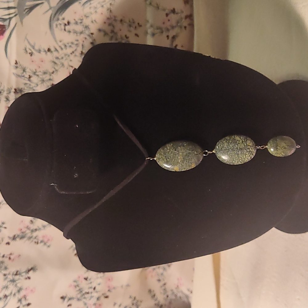 Leather necklace,3 coral stones,silver wire,11 inches long, it stretches